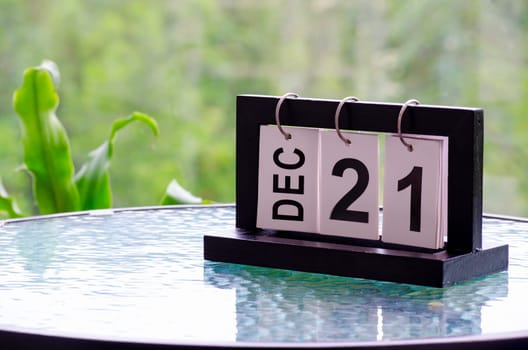 21 December calendar on marble table with customizable space for text. December calendar concept.