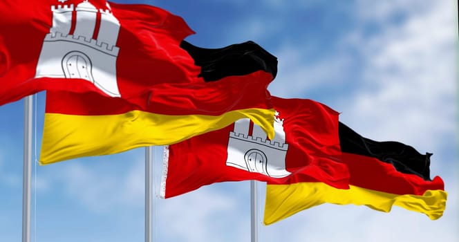 Hamburg city-state flags waving with german national flags on a clear day. 3d illustration render. Selective focus. Fluttering fabric