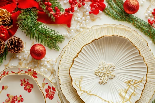 Beautifully arranged holiday table featuring decorative plates ornaments pine branches and red accents for a festive celebration.
