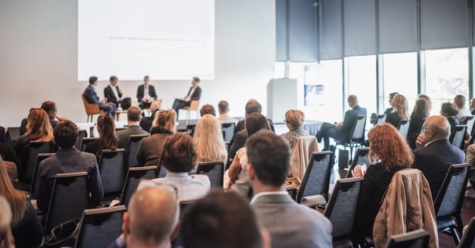 Interview and round table discussion at business convention and presentation. Audience at the conference hall. Business and entrepreneurship symposium.