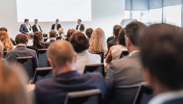 Interview and round table discussion at business convention and presentation. Audience at the conference hall. Business and entrepreneurship symposium.