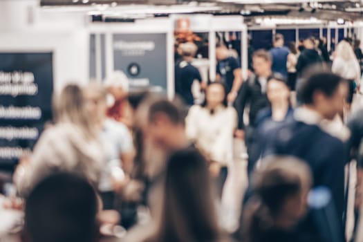 Abstract blurred people at exhibition hall of expo event trade show. Business convention show or job fair. Business concept background