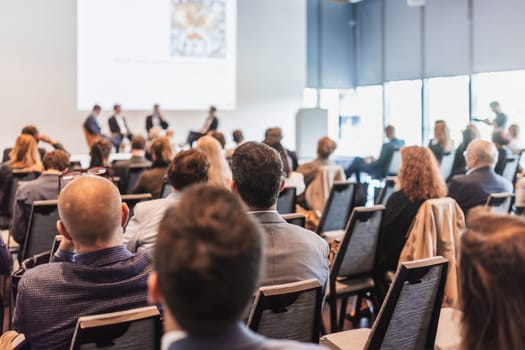 Interview and round table discussion at business convention and presentation. Audience at the conference hall. Business and entrepreneurship symposium.