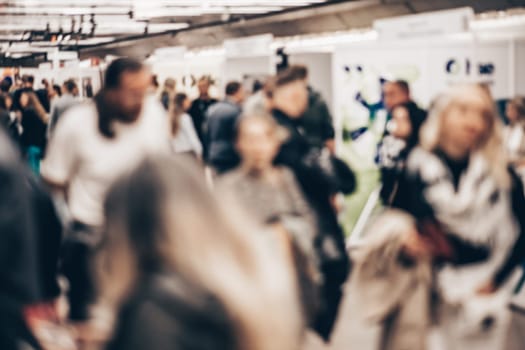 Abstract blurred people at exhibition hall of expo event trade show. Business convention show or job fair. Business concept background
