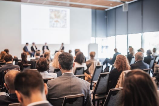 Interview and round table discussion at business convention and presentation. Audience at the conference hall. Business and entrepreneurship symposium.