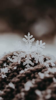 A beautifully intricate snowflake rests on a branch, highlighting its unique crystalline structure.