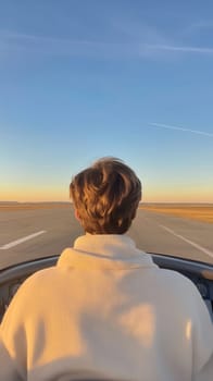 A young pilot looks out over the runway, bathed in the golden light of a sunset, embodying adventure and dreams.