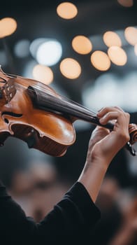 Close up of a musician's hands gracefully playing the violin, capturing the essence of musical passion.