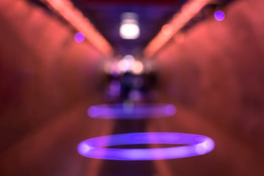 Blur abstract corridor tunnel with colorful bokeh lights background