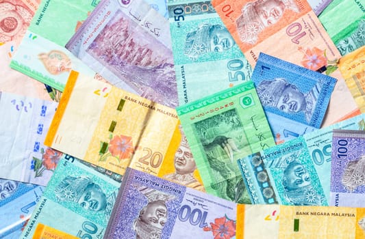 Malaysia currency of Malaysian ringgit banknotes background. Paper money of one, five, ten, twenty, fifty and hundred ringgit notes. Financial concept.