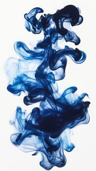 Dark blue ink disperses in clear water, forming intricate and fluid shapes. The movement creates a mesmerizing display of swirling patterns and vibrant color contrasts.