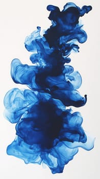 Blue ink gracefully swirls and flows against a white background, forming unique abstract shapes. The fluid motion captures a sense of creativity and artistic expression in a minimalist style.