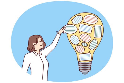 Businesswoman near light bulb with stickers in form dialogue bubbles symbolizing new ideas after brainstorming. Metaphor of cooperation in company to get innovative ideas to improve business processes