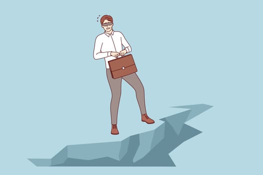 Challenge for business man standing at edge of abyss, blindfolded, and in need of help of guide. Problem of commercial helplessness and lack of information to overcome challenge or crisis