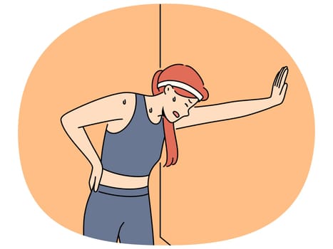 Tired woman runner with sweat on face, leaning against wall and trying to catch breath after long run. Young girl runner needs help of trainer due to excessive fatigue after workout.