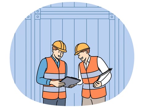 Men work in industrial field and stand near sea shipping containers discussing logistics or storage cargo. Teamwork of transport company employees dressed in industrial uniforms and hardhat