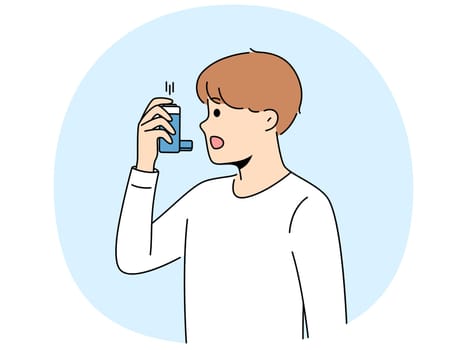 Boy uses inhaler to treat asthma attack due to difficulty breathing and lung disease. Child holds inhaler for flu patients, need treatment for cough and fever caused by dangerous virus.