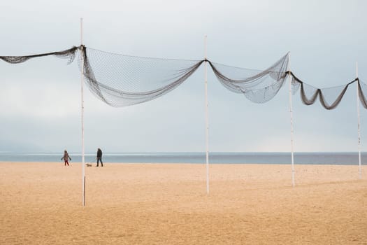 Peaceful walk on the beach in Nazaré, Portugal
