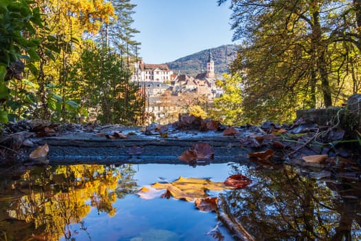 Autumn view of the old spa town of Baden-Baden reflected in a fountain, Baden-Württemberg, Germany