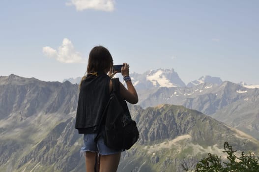 woman taking a picture of Valloire