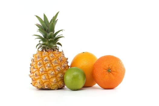 Colorful arrangement of pineapple, orange, lime, and tangerine on a white background. Perfect representation of tropical freshness, health, and nutrition, ideal for diets and food choices