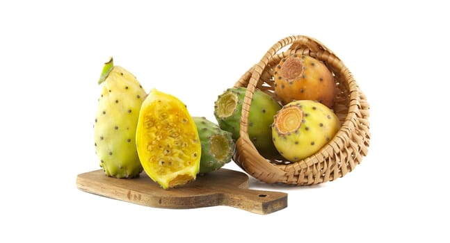 A collection of vibrant prickly pears, both whole and halved, displayed in a basket and on a wooden board. Perfect for concepts of healthy eating, exotic fruits, and natural ingredients