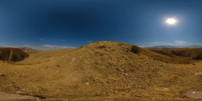 Full Spherical panorama of dry grass hills at sunny autumn day with clear blue sky above in equirectangular projection