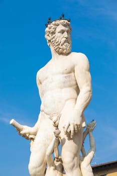 Florence, Italy - Neptune Fountain. Marble sculpture, Renaissance masterpiece, naked Poseidon statue