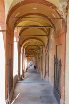 Bologna, Italy - 14 June 2024: traditional porticoes from Bologna city center to San Luca church