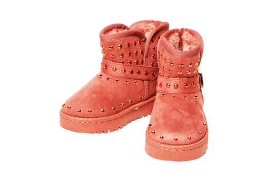Winter boots for children. Close-up of a pair of elegant brown suede winter boots which are lined with fur. Girls winter shoe fashion isolated on a white background.
