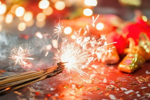 A group of sparklers glows brightly illuminating colorful decorations as people celebrate during a festive evening filled with joy.