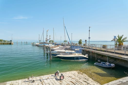 Boats at the harbor pier in the popular vacation resort of Meersburg on Lake Constance, Bodensee in Germany