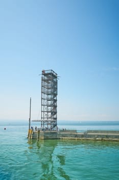 The Moleturm with some tourists at the harbor pier near Friedrichshafen on Lake Constance, Bodensee in Germany