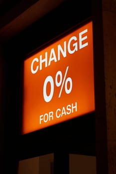 Illuminated sign for an exchange office in Prague, offering zero percent fees for exchanging cash