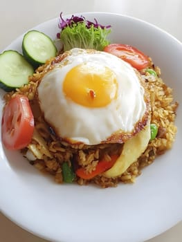 Nasi goreng Fried rice indonesian food dinner dish with vegetables