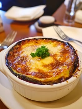 Cooking a fresh homemade moussaka recipe meal. Tasty Dish of Food with cheese