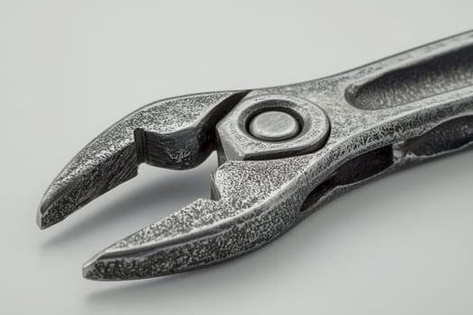 This close-up view of a metal pliers highlights its intricate design and texture. The image captures the tools sharp edges and robust build, perfect for various mechanical tasks.
