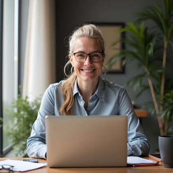 Middle age woman with laptop