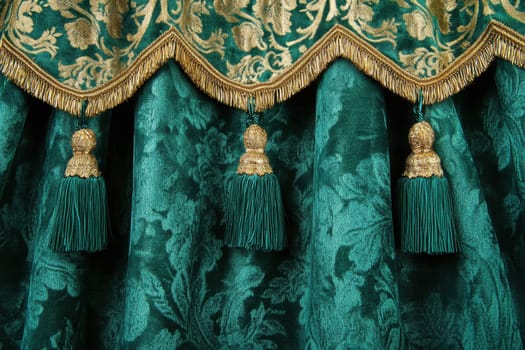 Exquisite emerald green velvet curtain featuring ornate gold trim and tassels. Perfect for luxurious stage settings, home interiors, or elegant events.