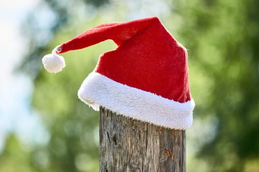 santa Claus hat is put on a pole. High quality photo
