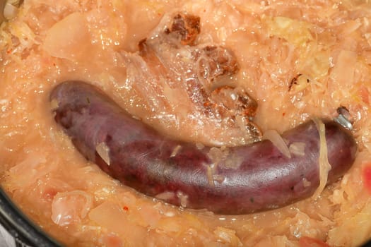 German specialty blood sausage with sauerkraut in a closeup
