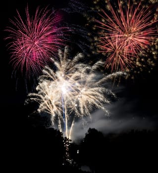 Firework display on the night sky at a festival
