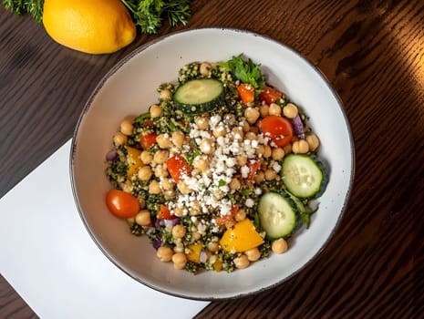 Healthy Vegetarian Chickpea salad meal with cucumber and tomatoes