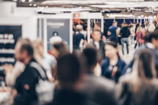 Abstract blurred people at exhibition hall of expo event trade show. Business convention show or job fair. Business concept background