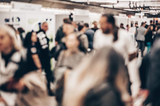 Abstract blurred people at exhibition hall of expo event trade show. Business convention show or job fair. Business concept background