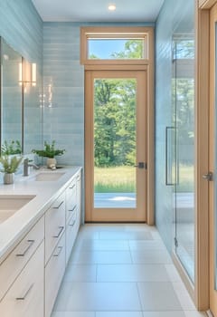 Bright and spacious bathroom featuring a sleek design, large windows, and a view of the greenery outside, creating a serene atmosphere.