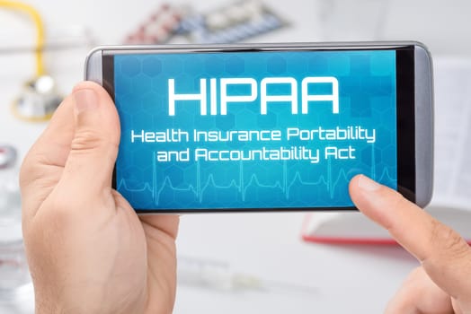 A smartphone with the text HIPAA