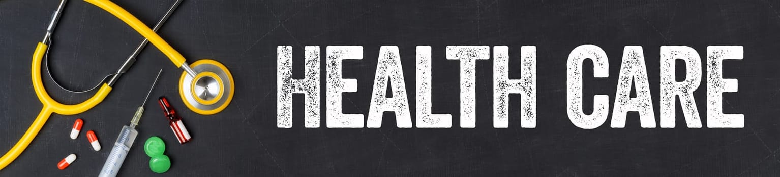 Stethoscope and pharmaceuticals on a blackboard - Health care