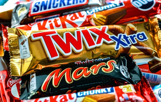 POZNAN, POL - NOV 20, 2024: Variety of popular brands of confectionery products