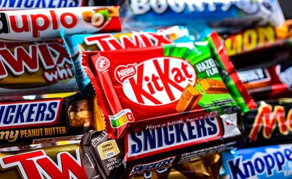POZNAN, POL - NOV 20, 2024: Variety of popular brands of confectionery products